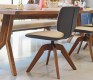 Beautiful luxury two-tone leather dining chair with a swivel wood base