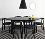 Black elliptical dining table seating 6 to 14