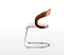 High-end luxury cantilever dining chair shown in walnut, white leather and chrome