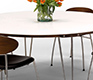 Corian Round Table from Denmark, shown with walnut