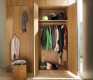Floor to ceiling hallway cabinets with coat rack