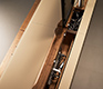 Easily-accessible cable tidy run on the high-end TV cabinet in wood and glass
