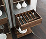 Close up of the cutlery drawer in the high-end Nox glass and solid wood display cabinet