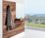 Luxury high-end modern coat rack shown in walnut and with an integrated mirror