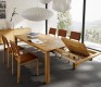 Luxury solid wood extending dining table shown in oak