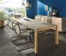 High-end luxury extendable dining table shown with grey glass table top finish
