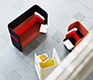 Pod breakout sofa and rotating chair shown in red