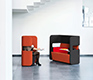 Pod sofa and rotating breakout area chair shown in red