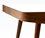 Retro walnut and Corian desk corner detail