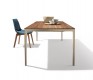 Super slim extendable dining table shown in walnut