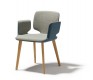 The high-end Aye carver dining chair shown in two-tone upholstery