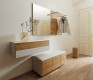White leather-upholstered hallway bench with wall cabinet and mirror