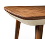 Corner detail of the Flaye wood and leather dining table