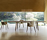 Hardwood and leather combine in this extended Flaye dining table