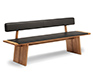 Luxury oak dining bench with black leather-upholstered seat padding and backrest