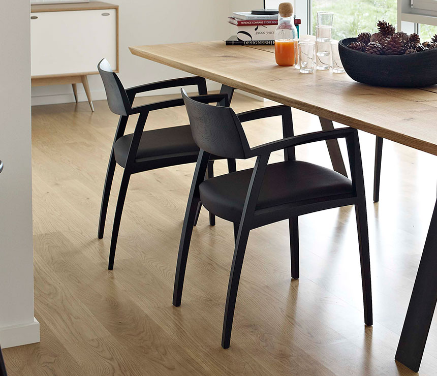 The black DM326 dining chair slightly from the back