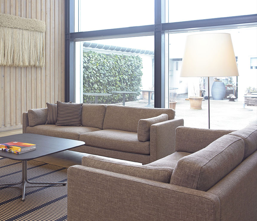THE EJ 220 sofa from Erik Jorgensen shown in brown fabric