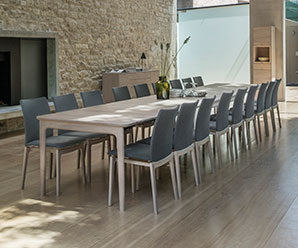 Danish walnut dining table that can seat up to 20 people when fully extended