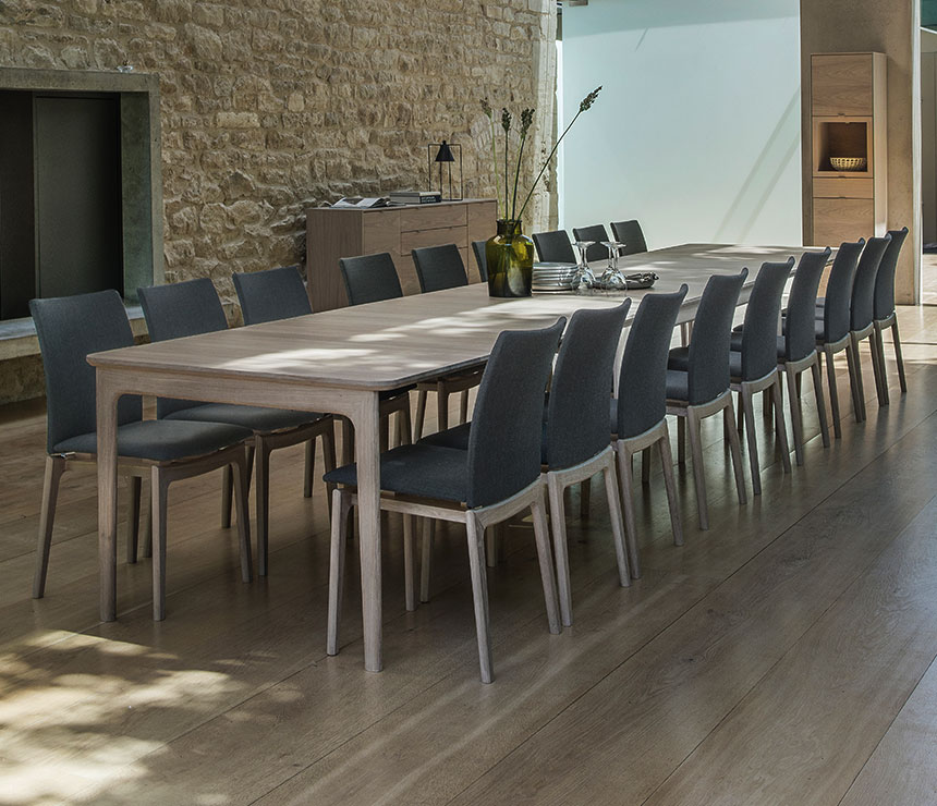 Contemporary very very long dining table able to seat 20 people