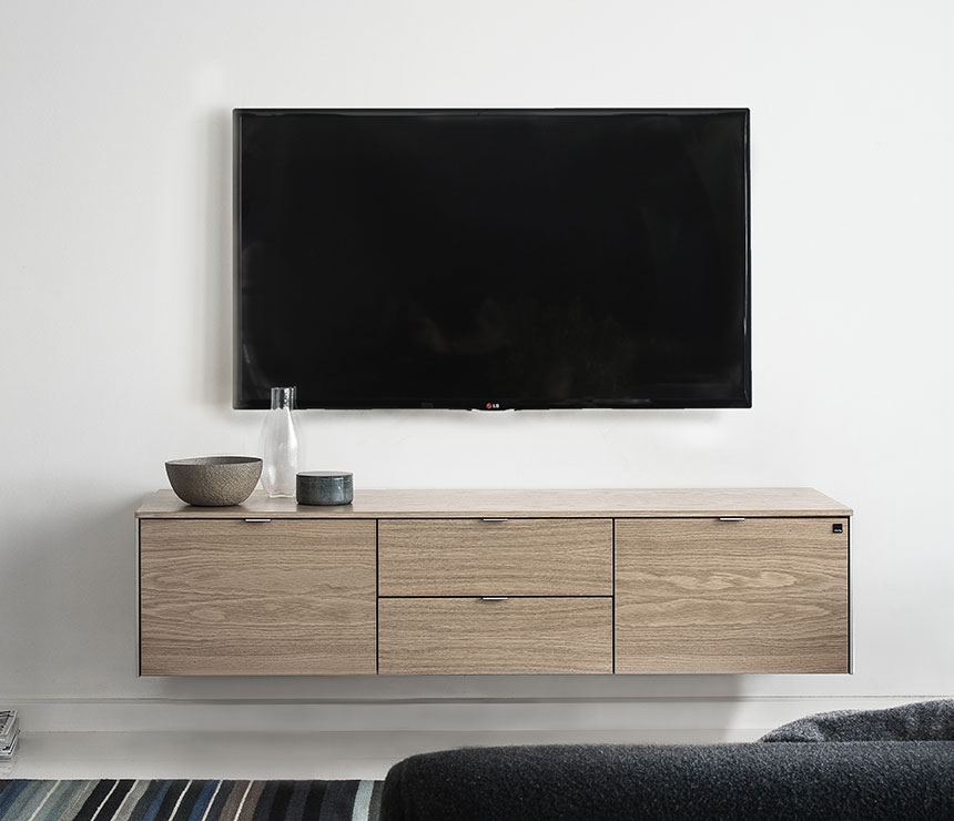 Danish wall hanging media cabinet shown in oak