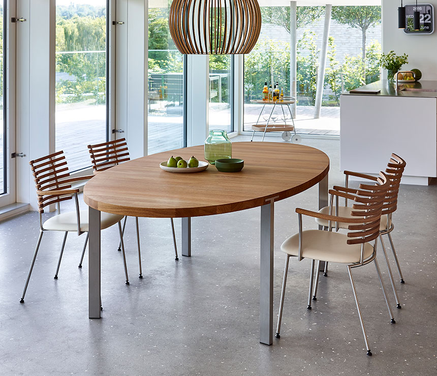 Modern oval dining table in solid walnut and a range of other woods