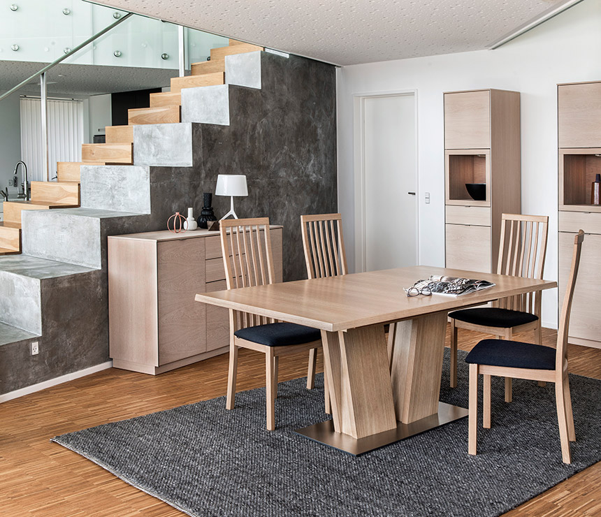 Extended v-shaped-legged oak dining table