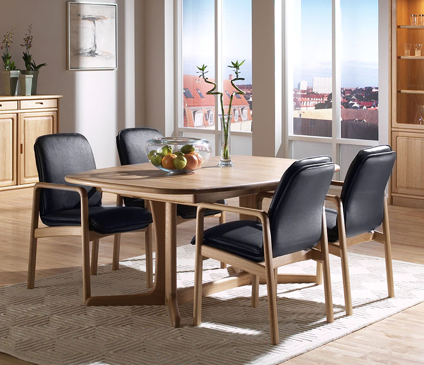 Danish fine dining room table shown in oak