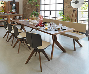 Combines modern and traditional craftsmanship in a maple wood dining table