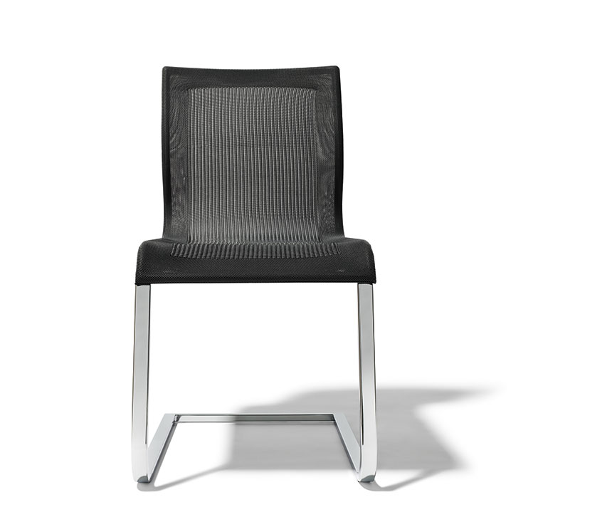 Black cantilever dining chair upholstered in Stricktex