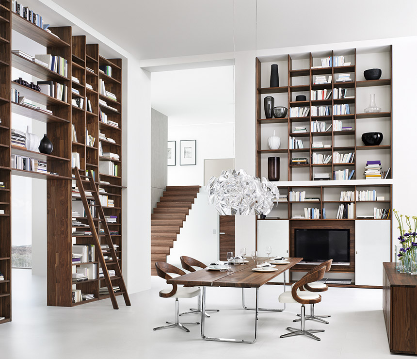Luxury modern bookcases shown in walnut and white glass
