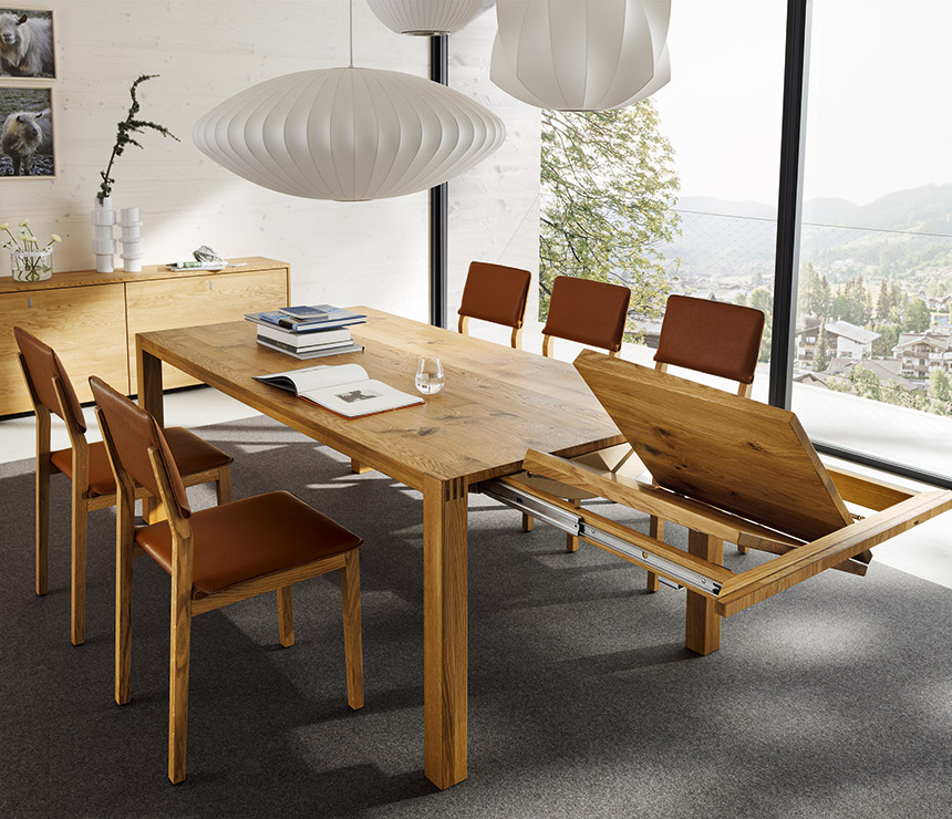 Luxury solid wood extending dining table shown in oak
