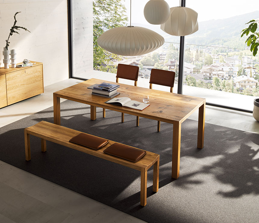 Luxury solid wood dining table shown in oak