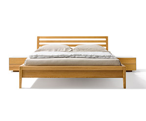 The Mylon Wood bed has solid walnut side panels
