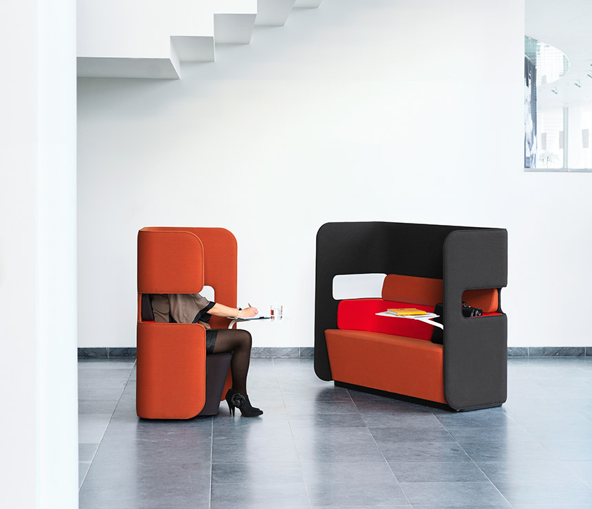 Pod sofa and rotating breakout area chair shown in red