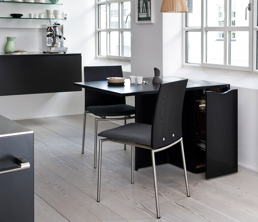 Small black dining table that extends to seat 6