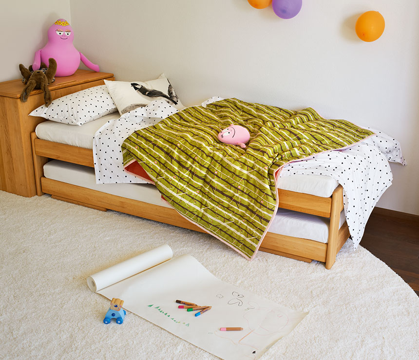 Tandem solid alder wood kids bed shown with spare bed