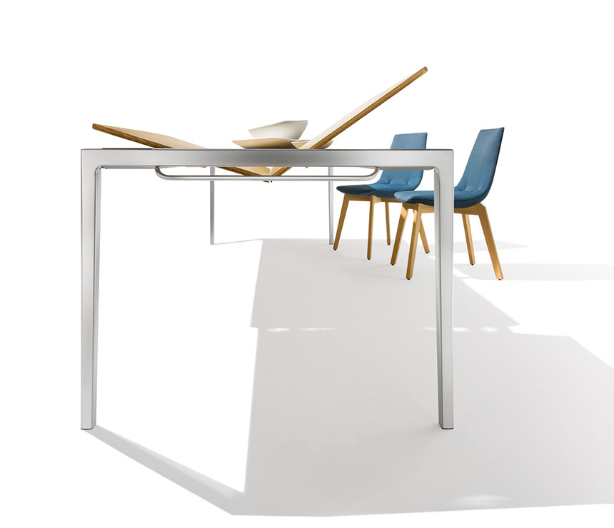 The butterfly extension system on the Tak super slim dining table