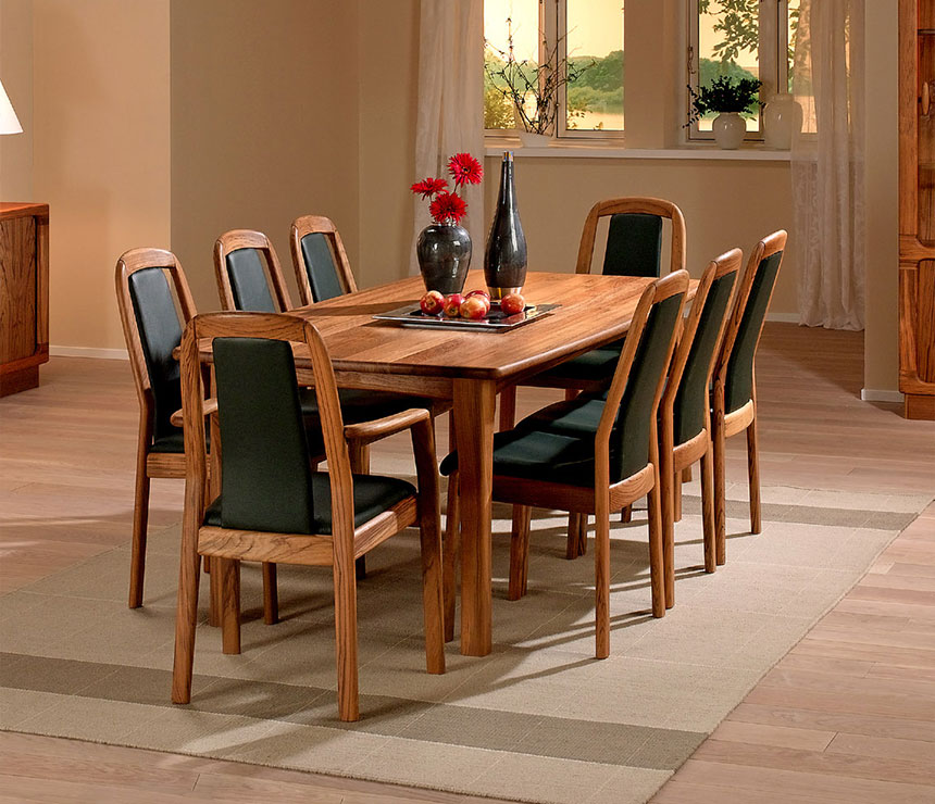 Danish traditional solid wood dining room table shown in teak