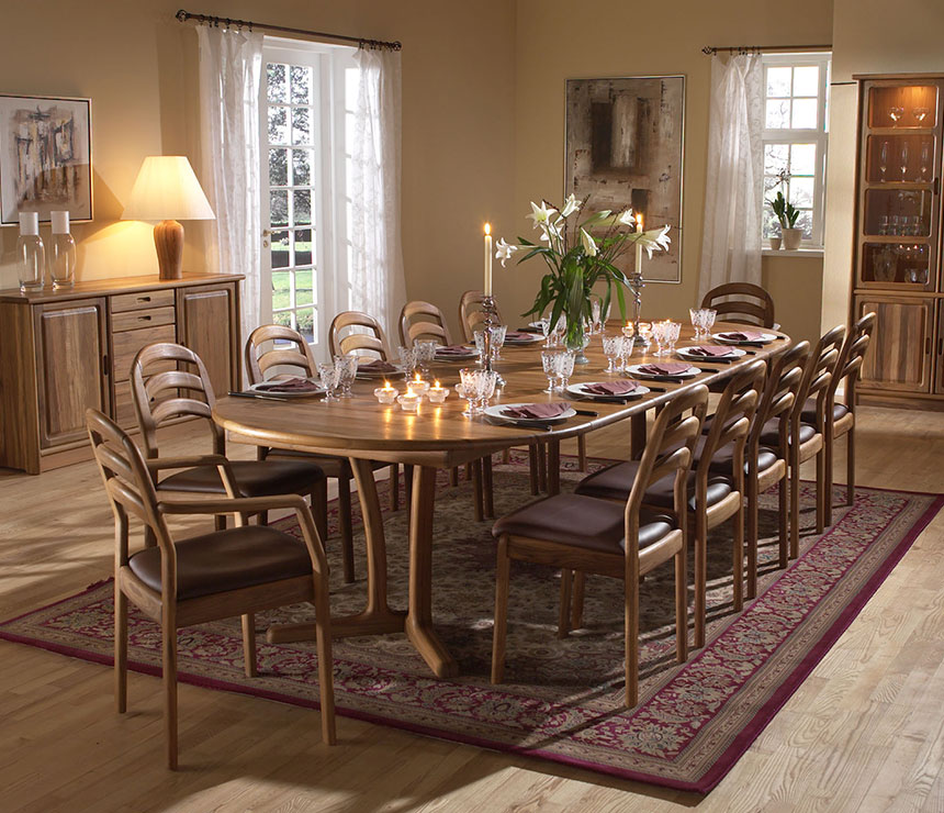 Traditional Danish teak round dining table shown extended