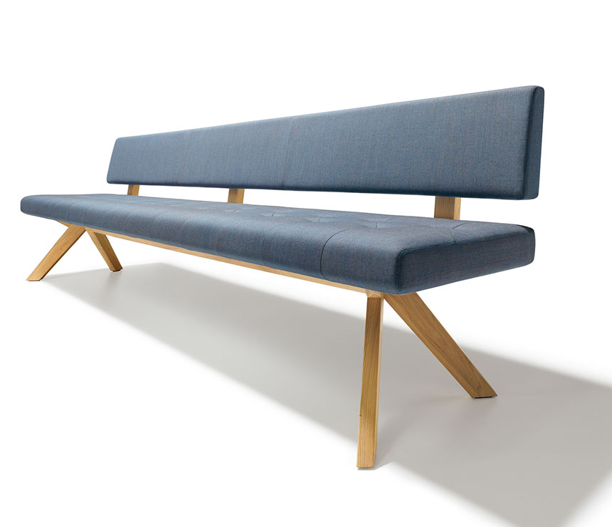 High-back dining bench shown in blue upholstery fabric and solid hardwood